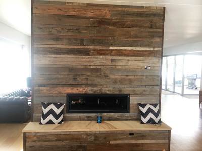 Timber feature wall in living room by Northern Rivers Recycled Timber - Brushed pipeline panels