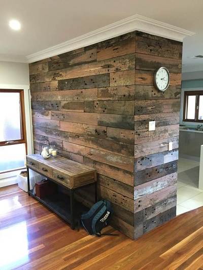 Timber feature wall in living room by Northern Rivers Recycled Timber - Artisan Sleeper panels